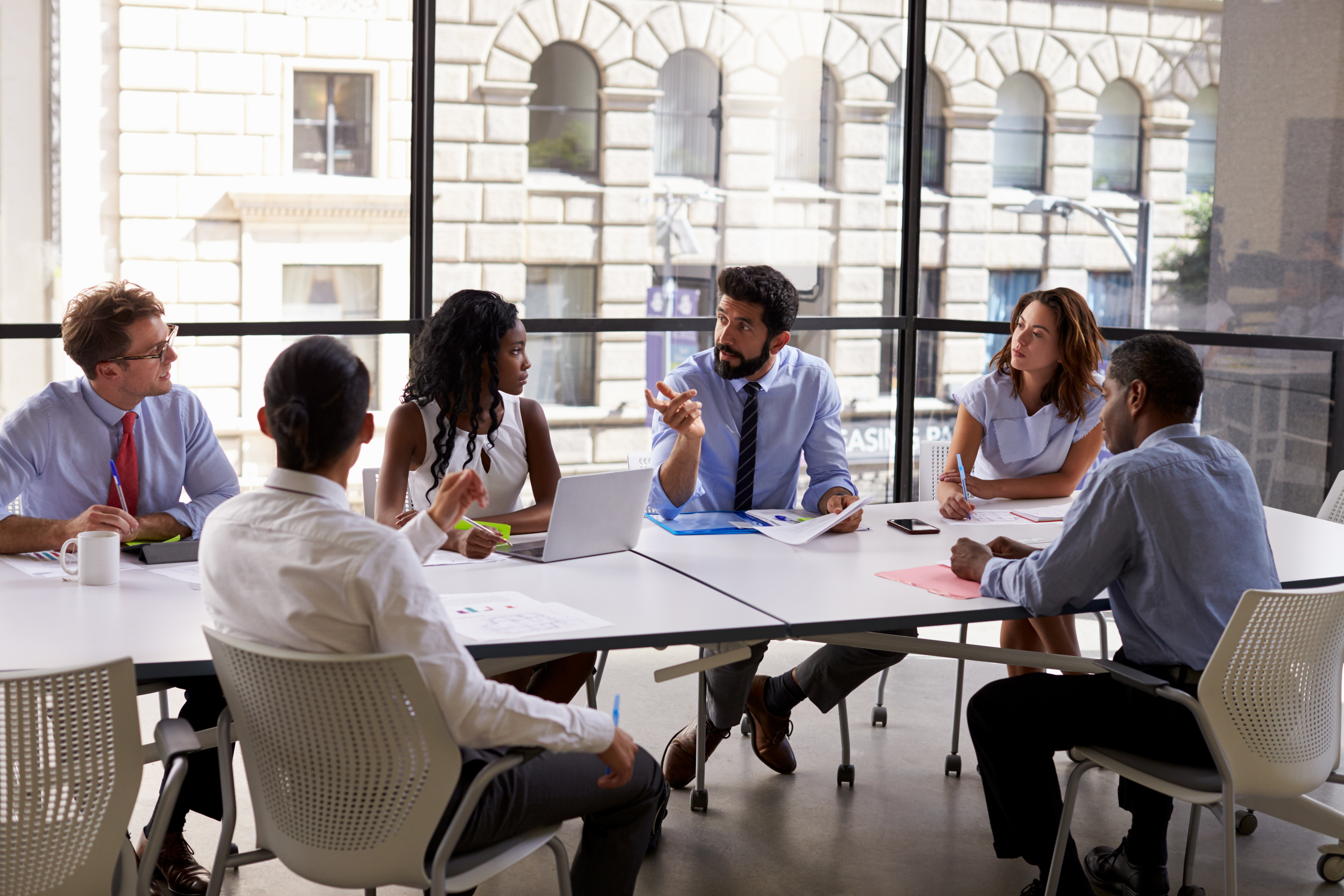 Corporate business team and manager in a meeting, close up